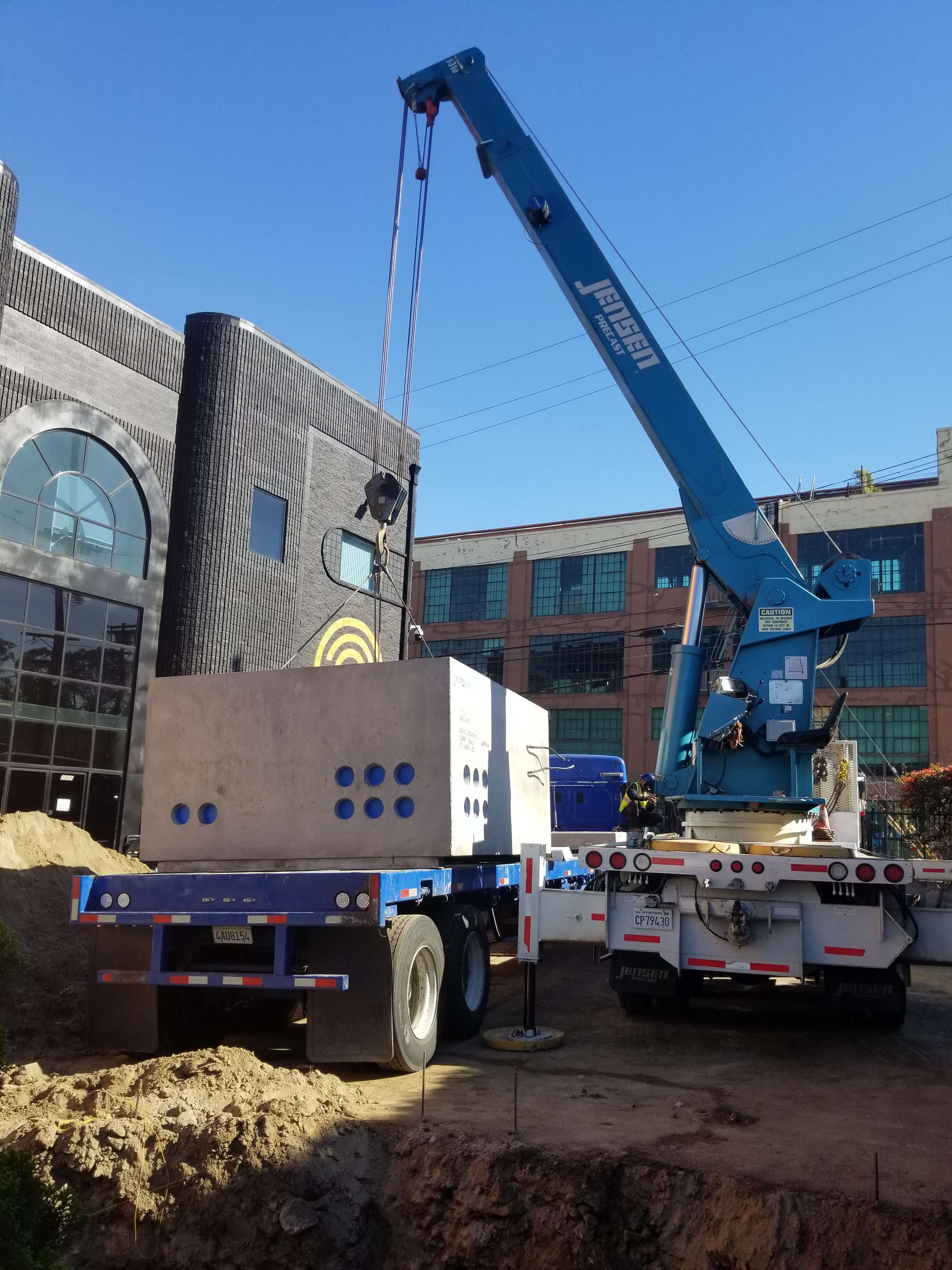 Crane lowering cast into hole